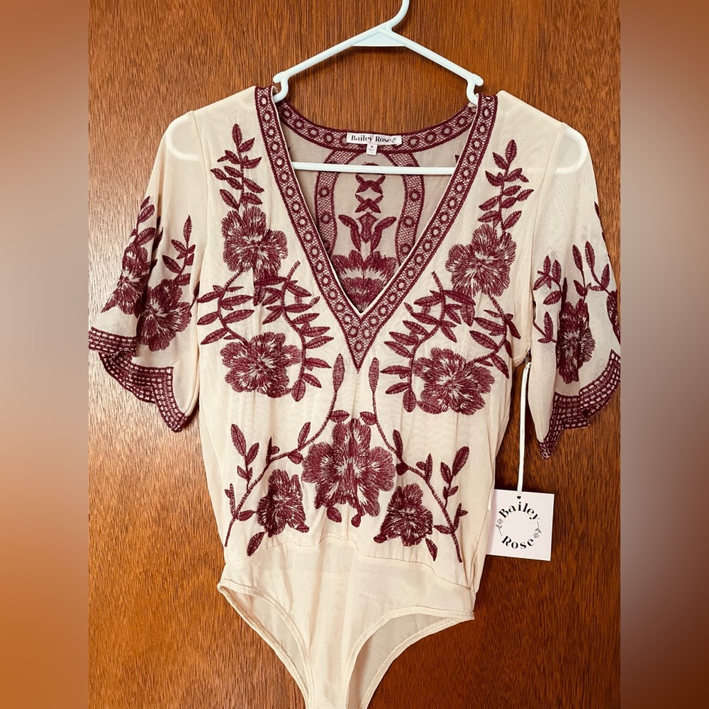 NEW with tags, boutique beautiful embroidered body suit. Women’s
